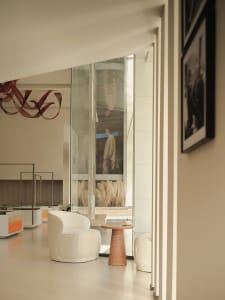 Modern, minimalist retail stall with glass display cases and concrete counter