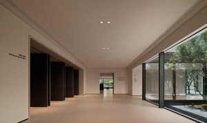 A minimalist corridor with clean lines and white walls.