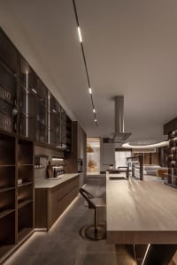 Modern kitchen featuring a wooden countertop with sleek, minimalist design.