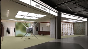 A modern retail installation featuring a futuristic, star-like object and various displays.