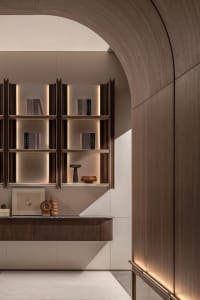 A modern library with floating shelves and wooden paneling.