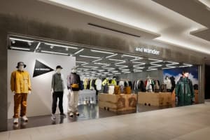 Modern retail storefront with concrete materials and clothing displays