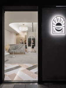 A modern reception desk with a marble finish.