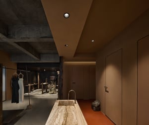 Modern retail storefront featuring concrete and marble materials.