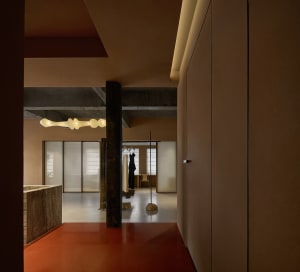 A modern clothing store with concrete walls and minimalist design.