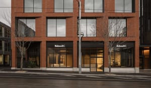 Modern retail storefront with large glass windows and brick exterior