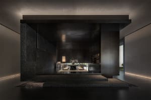 A modern minimalist living room with concrete walls and a central lighting feature.