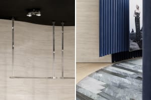 Modern retail storefront with wooden paneled walls and marble floor.