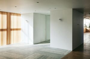 Modern office lobby featuring wooden window blinds