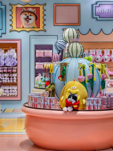A vibrant and colorful pet shop interior with various products and decorations.