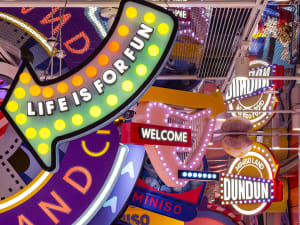 An array of colorful, illuminated retail signage in a vibrant interior setting.