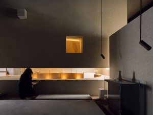 A modern residential interior featuring concrete materials.