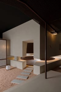 A modern minimalist interior with concrete and wooden elements, featuring a minimalist design with a focus on simplicity and 
