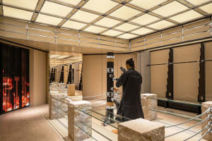 A modern retail store featuring glass, concrete, and metal elements.