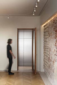 Minimalist interior design featuring concrete and wooden elements.