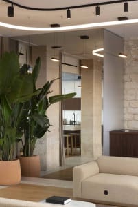 Modern living room featuring concrete walls and a minimalist design.