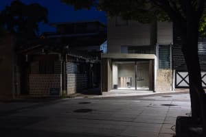 A modern urban architectural design featuring contemporary lighting.