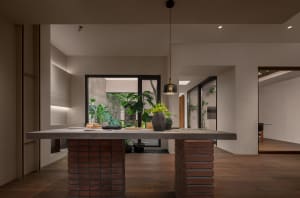 A modern kitchen with a concrete countertop.