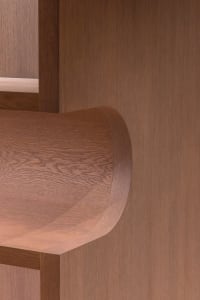 Modern minimalist bookshelf with curved wooden edges