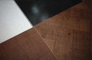 Different patterns of wooden floor tiles displayed on a floor.