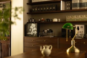 A cozy, contemporary modern office space features wood, glass, and metal elements.