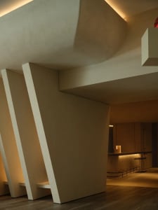 Modern, minimalist bar area featuring concrete architecture and lighting.