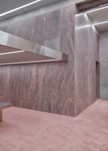 Modern office lobby featuring granite flooring and minimalist design elements.