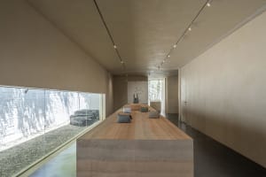 A minimalist retail space featuring a concrete countertop.