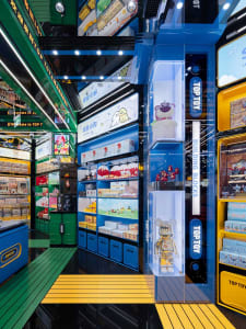 A colorful and modern toy store with various shelves displaying toys and merchandise.