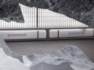 Close-up view of Bosideng retail storefront with fabric display and metal barriers