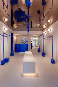 A modern interior design featuring blue accents in a commercial lobby setting.