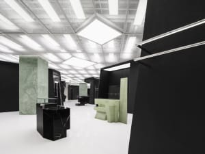 A minimalist furniture display featuring marble elements.