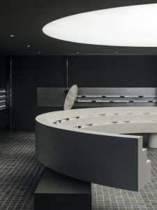 Modern retail display featuring concrete elements with glasses showcased.