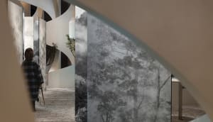 A modern interior with glass panels showcasing a landscape view.