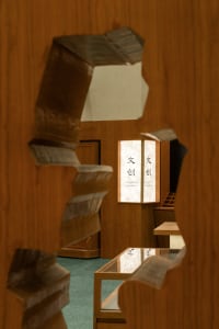 A storefront featuring wooden and glass elements.