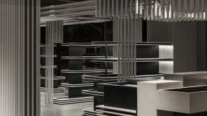 A modern interior design featuring black metal elements and minimalist decor.