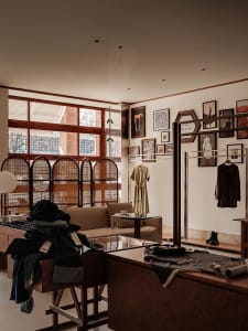 A modern retail storefront featuring wood materials for clothing shop