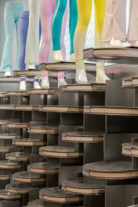 A display of colorful leggings in a retail store
