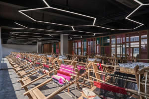 Rows of weaving looms in an industrial interior setting