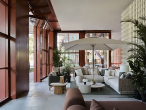 Modern lobby featuring concrete, wood, and fabric materials