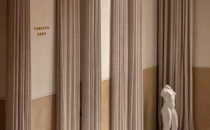 Minimalist interior design featuring textured fabric curtains.