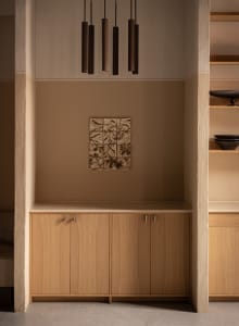 Modern minimalist wooden kitchen cabinets with a sleek design.