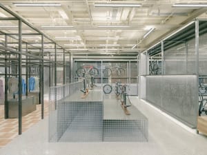 Modern retail space with metallic shelving and glass display cases.
