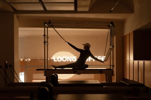 A minimalist exercise room with sustainable wood flooring, designed to promote health and wellness.