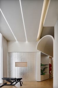 An image of a modern office with glass tiles and black metal decor.