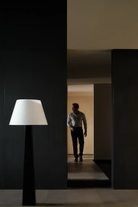 A minimalist lamp in a contemporary indoor setting.