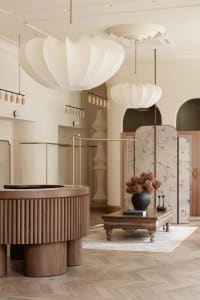 Modern retail shop featuring high-quality wood, fabric, and metal fixtures