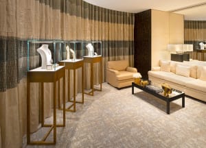 Modern retail jewelry store displaying jewelry in glass showcases.