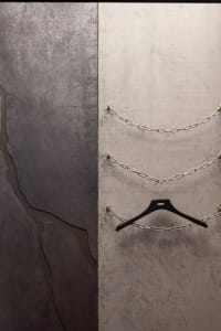 An industrial-style art installation featuring metal chains