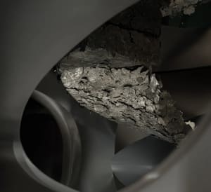 A photograph of an industrial staircase made of metallic material.